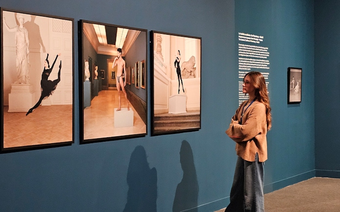 Tourist viewing art exhibit at the Russian Museum.