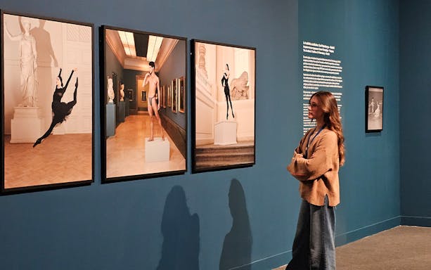 Tourist viewing art exhibit at the Russian Museum.