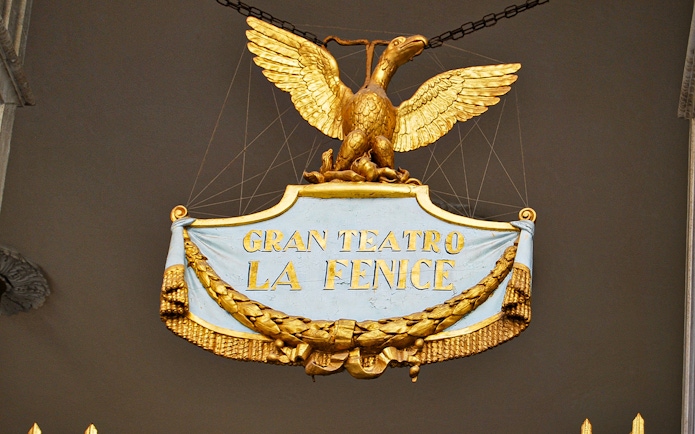 Gran Teatro La Fenice sign with golden eagle in Venice, Italy.