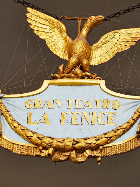Gran Teatro La Fenice sign with golden eagle in Venice, Italy.