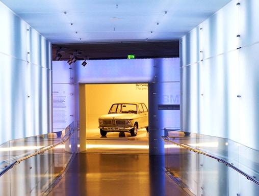 BMW Museum hallway leading to vintage car exhibit.