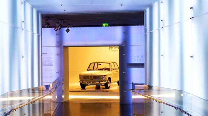 BMW Museum hallway leading to vintage car exhibit.