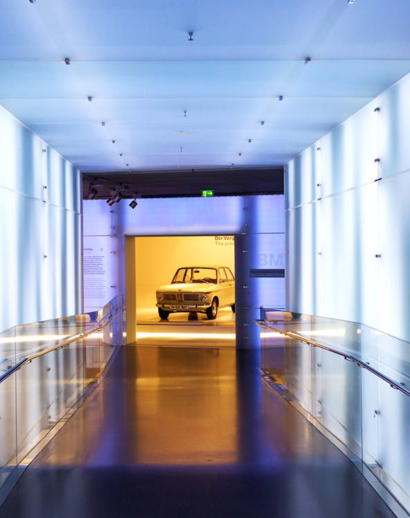 BMW Museum hallway leading to vintage car exhibit.