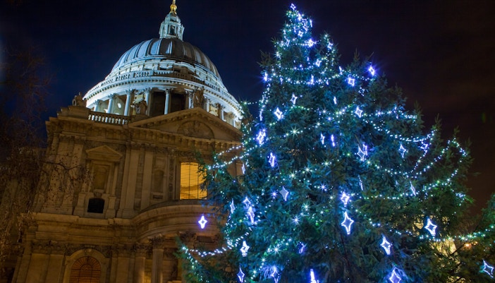 St. Paul's Cathedral with Christmas lights and decorated tree in London.