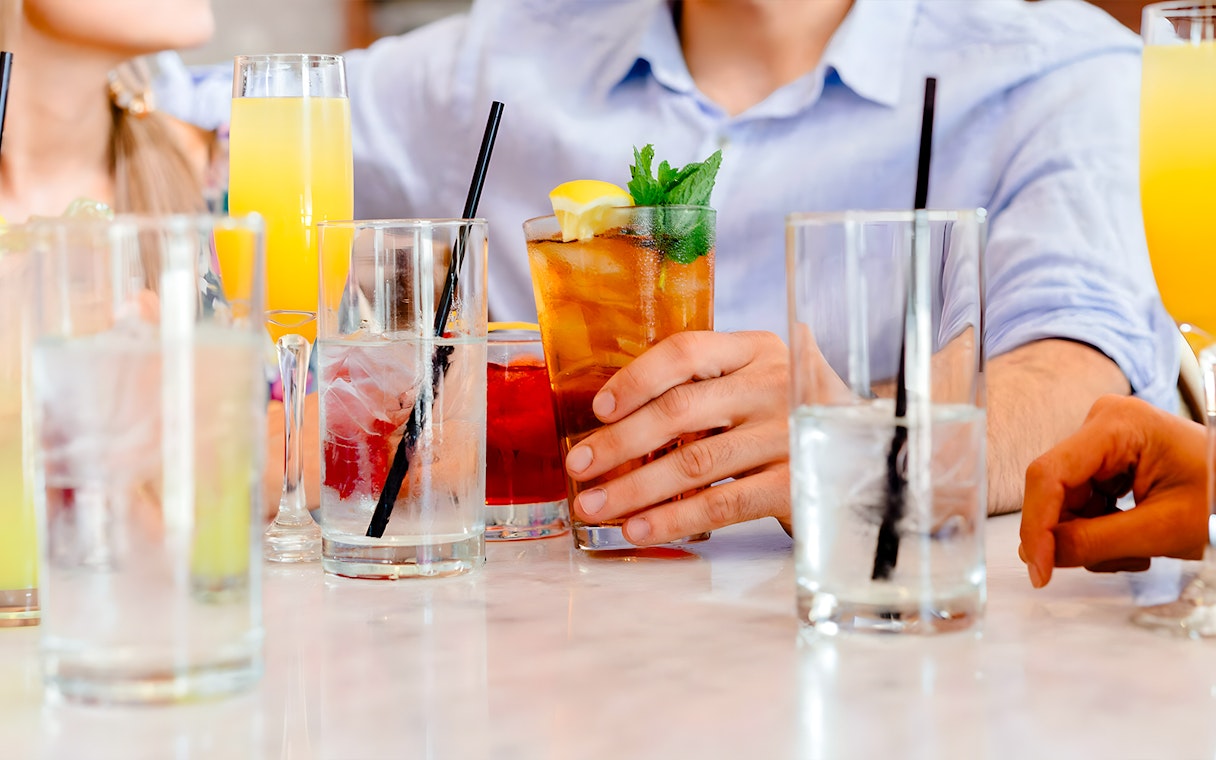 Guests enjoying drinks on Le Diamant Bleu Seine River cruise.