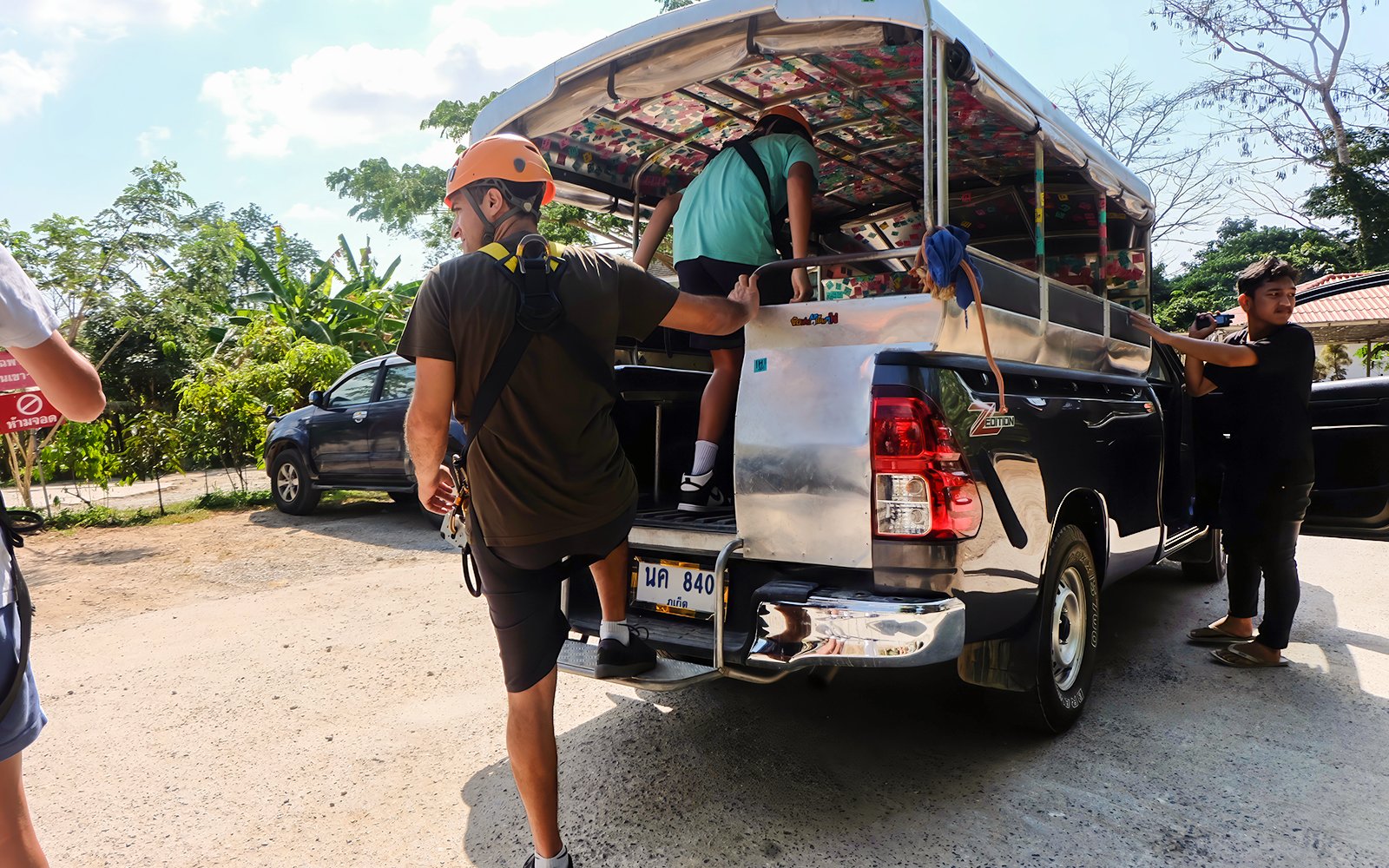 Participants boarding a truck for a zipline adventure in Phuket.