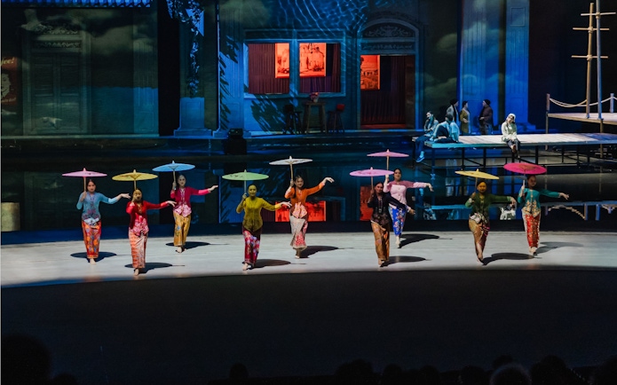 Women with umbrellas performing at The Legacy of a Generation Show.