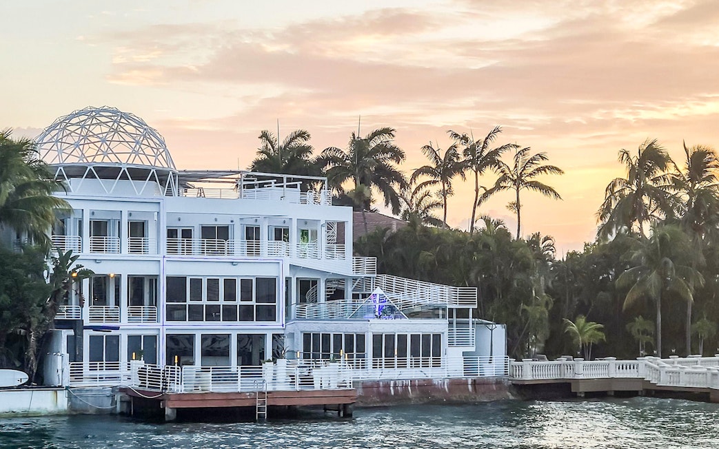 Luxury waterfront mansion with modern architecture on Miami Skyline Cruise.