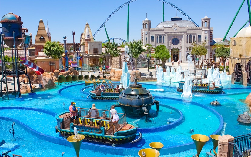 Boats navigating water ride at Land of Legends Theme Park, Antalya.