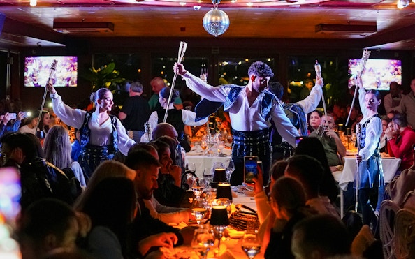 Dancers performing with torches during Bosphorus 4-Course Dinner Cruise, live entertainment.