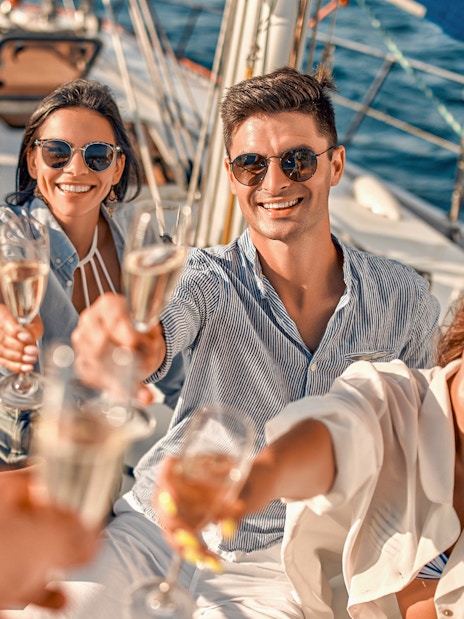 Group enjoying drinks on a sailboat during Metopi, Agistri & Aegina full-day cruise.