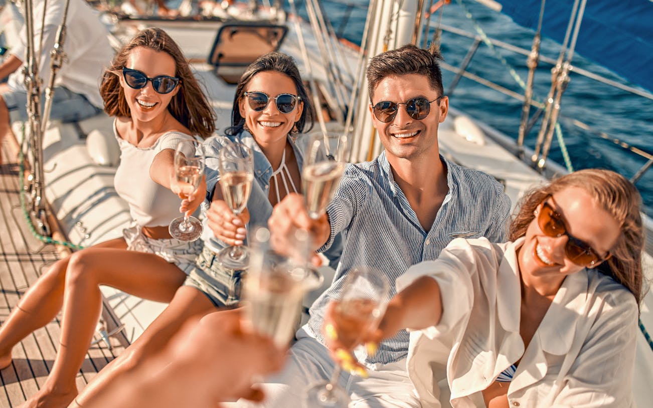 Group enjoying drinks on a sailboat during Metopi, Agistri & Aegina full-day cruise.