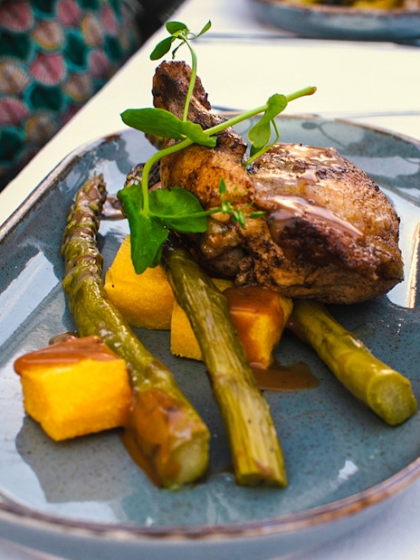 Grilled chicken with asparagus and polenta on Amsterdam dinner cruise.