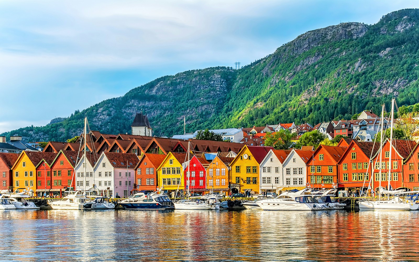 Hanseatic wharf in Bergen, Norway with colorful wooden buildings along the waterfront.