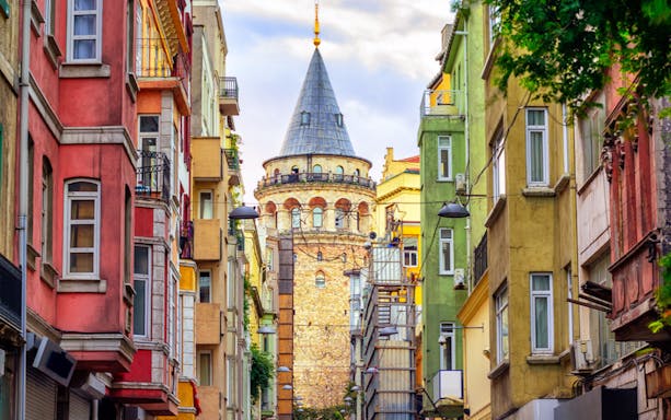 Galata Tower viewed from a colorful street in Istanbul.