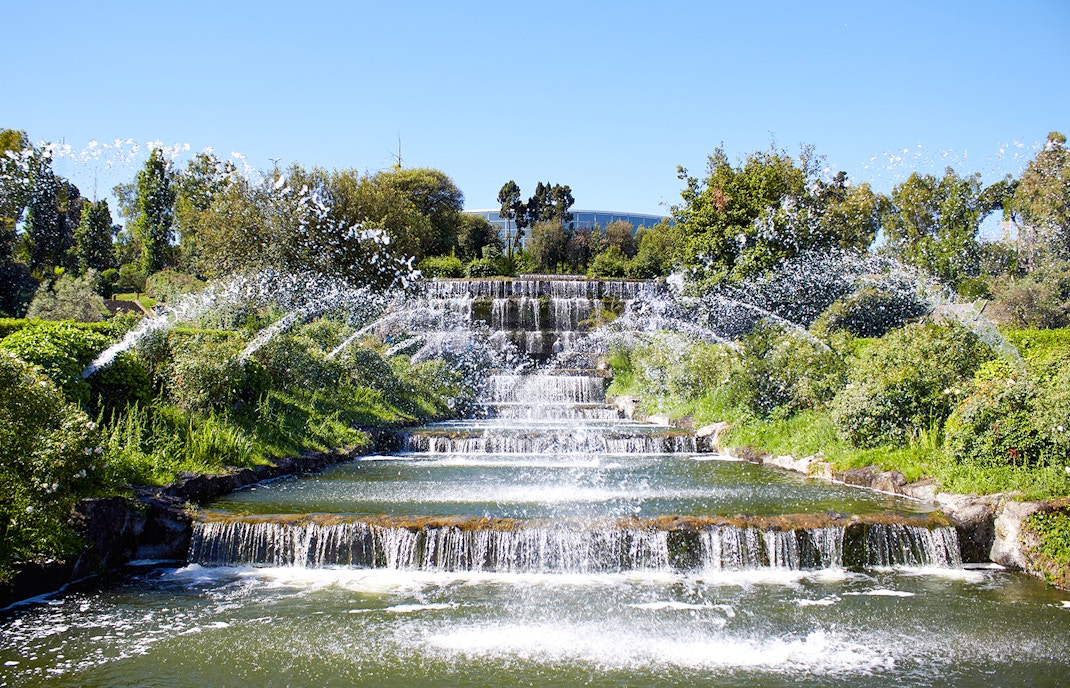 Giardino delle Cascate waterfall with cascading water and surrounding greenery in Rome.