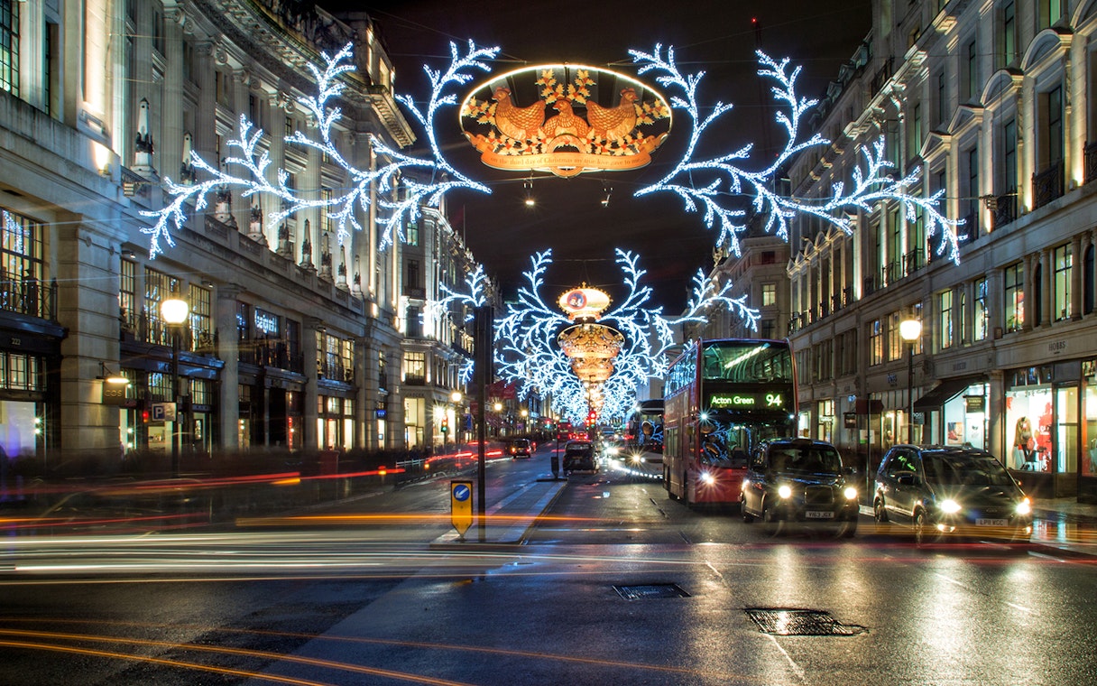 London street adorned with festive Christmas lights during the London Christmas Lights Tour.