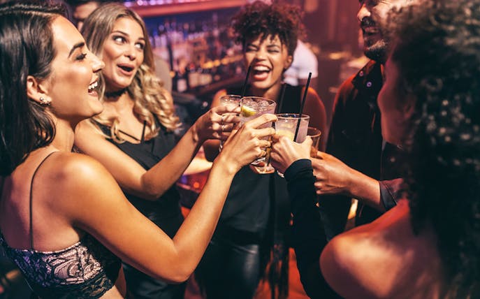 Group enjoying drinks during a Seoul pub crawl.