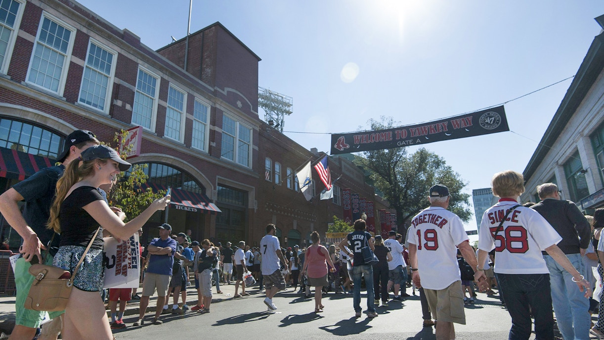 Crowd walking towards Fenway Park entrance in Boston.