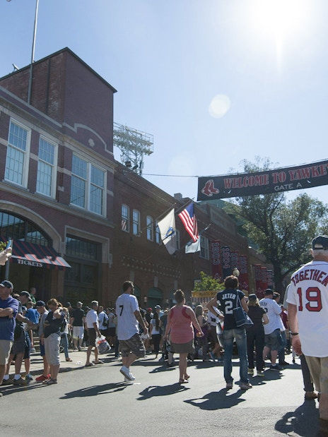 Crowd walking towards Fenway Park entrance in Boston.