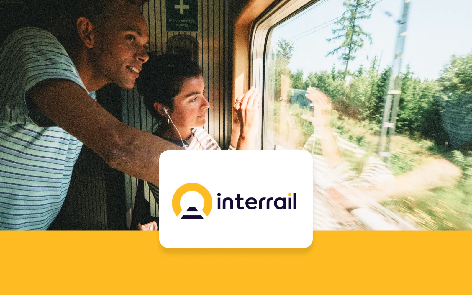 Travelers enjoying scenic views from a train window with Interrail Global Continuous Pass.