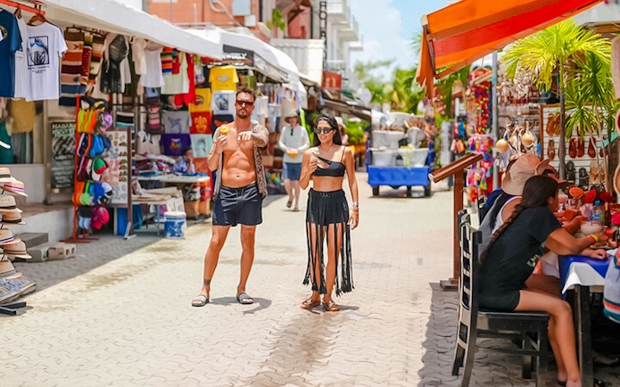 Pedestrian street with souvenir shops and restaurants in Isla Mujeres, Mexico.