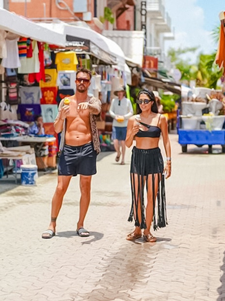 Pedestrian street with souvenir shops and restaurants in Isla Mujeres, Mexico.