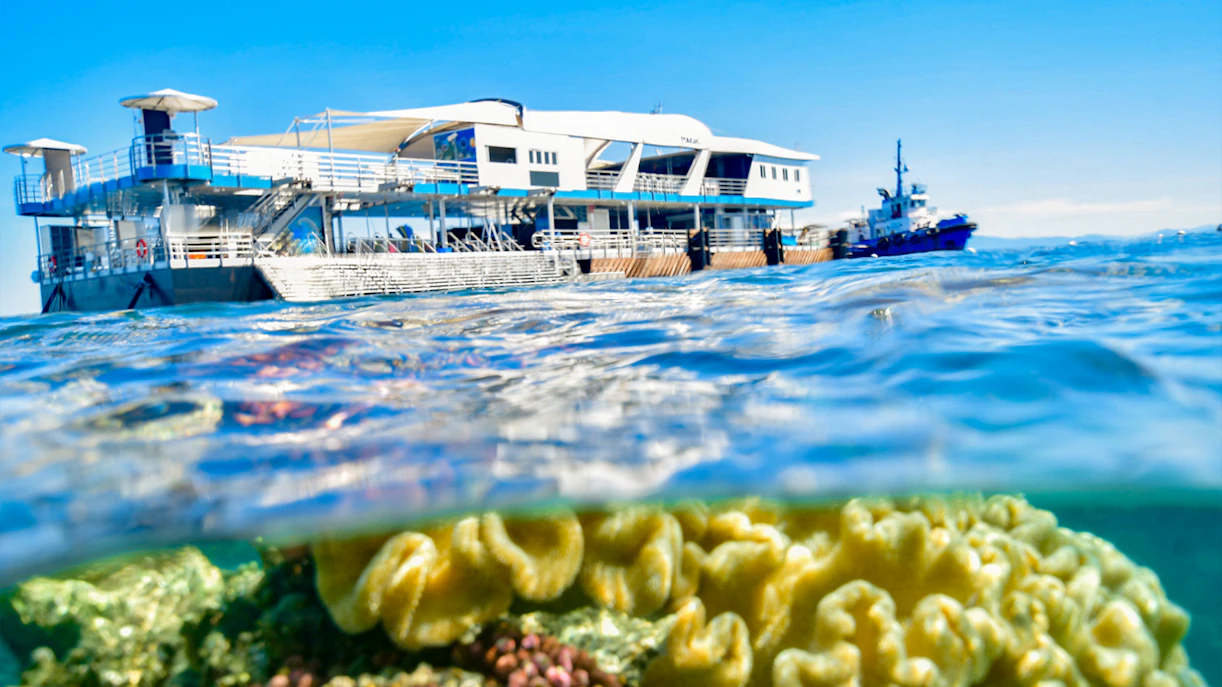 Cruise ship near coral reef in Great Barrier Reef, Cairns.