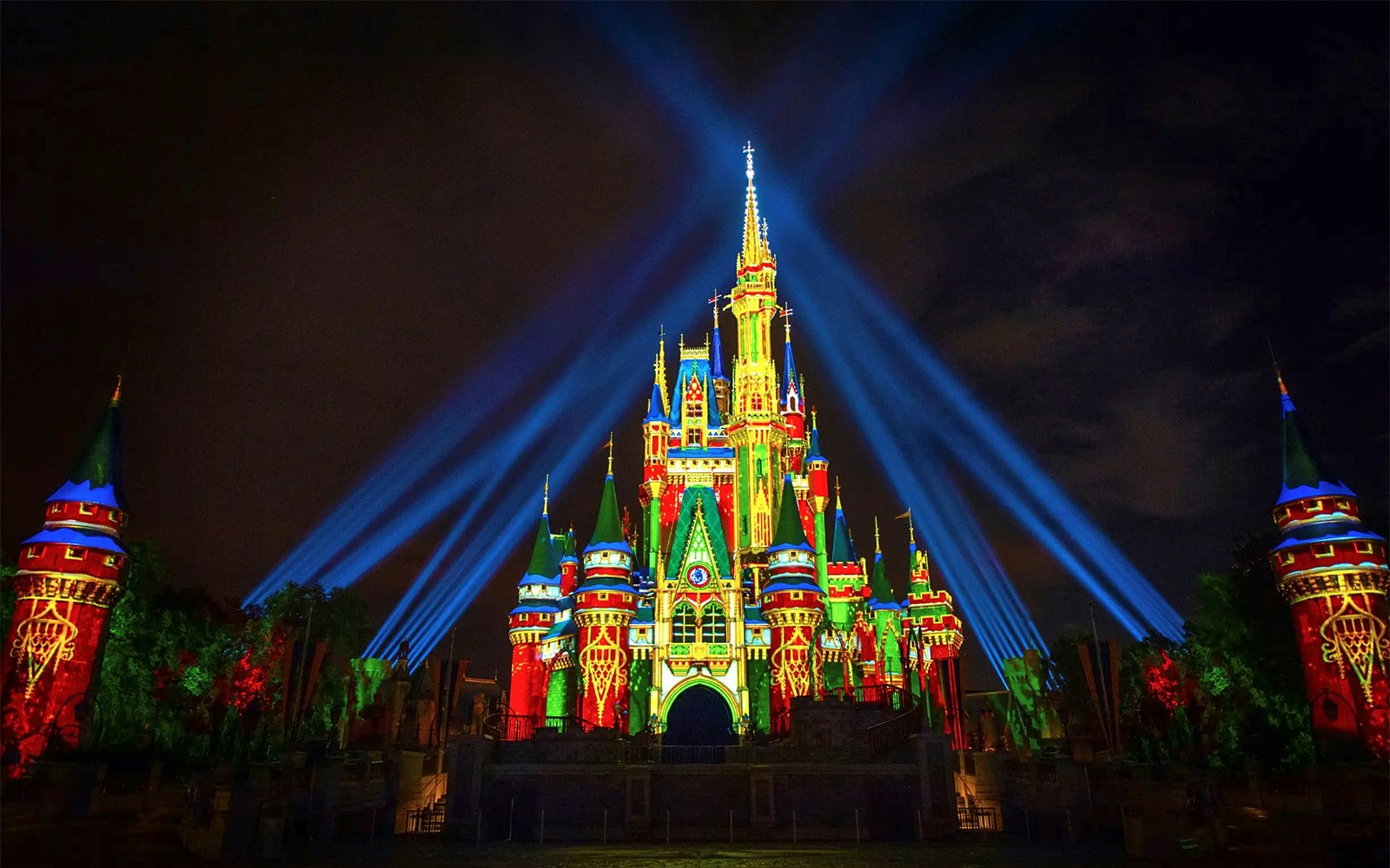 Disney Castle illuminated with lasers during Mickey's Not-So-Scary Halloween Party, Orlando.