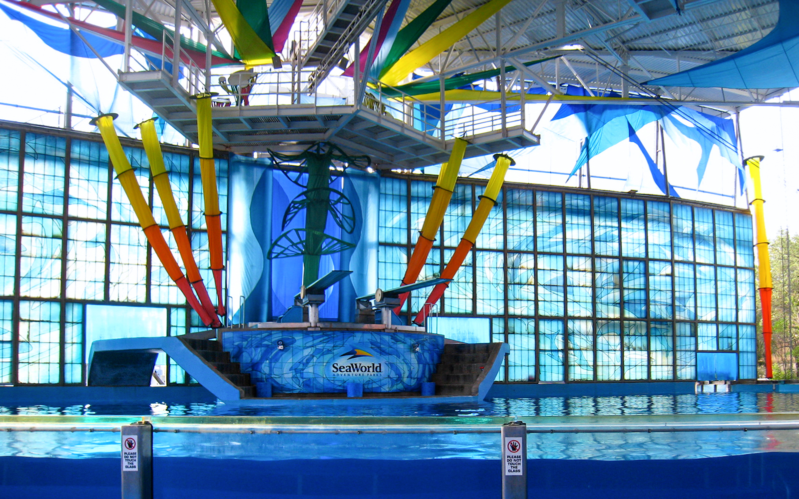 SeaWorld San Antonio dolphin show stage with colorful backdrop and pool.