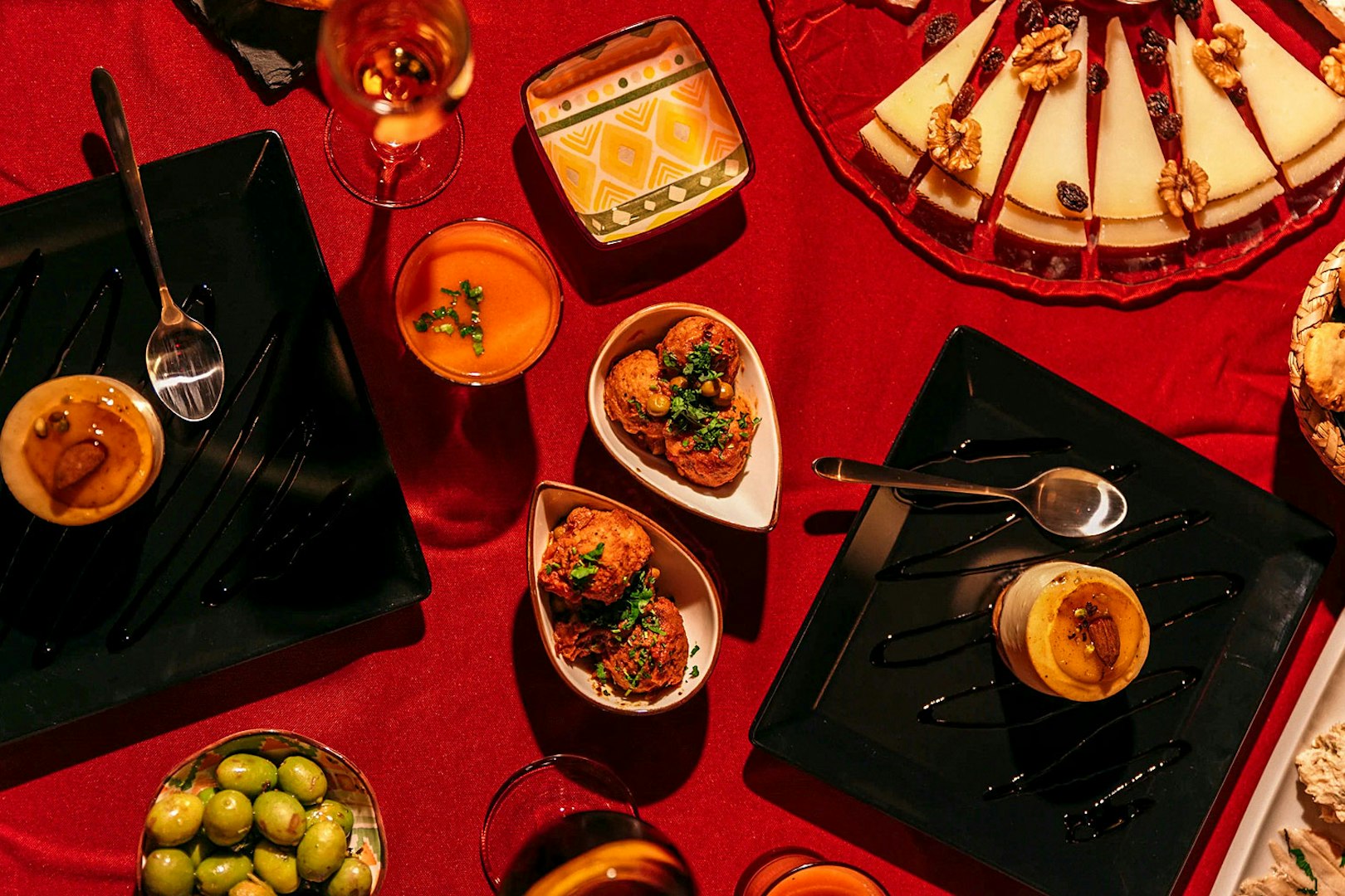 Traditional Spanish tapas on a red tablecloth at Laietana Flamenco Show.
