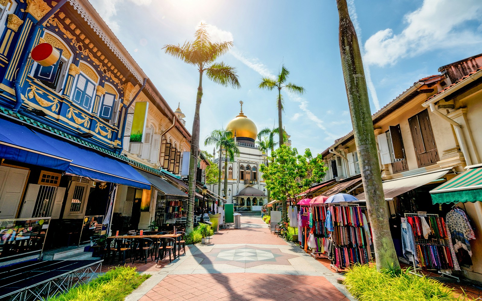 Kampong Glam Singapore street with colorful murals and traditional shophouses.