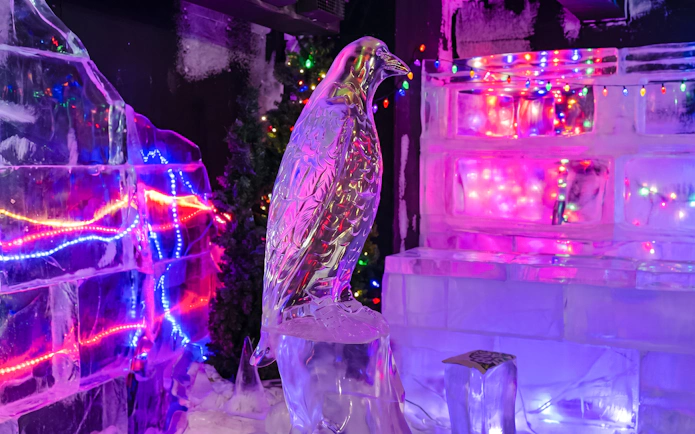 Ice sculpture of a bird with colorful lights at Chena Hot Springs, Alaska.