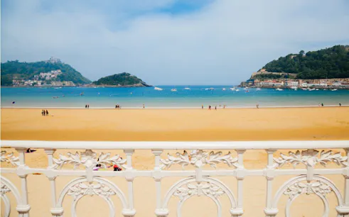 La Concha Beach view with ornate railing in San Sebastian, Spain.