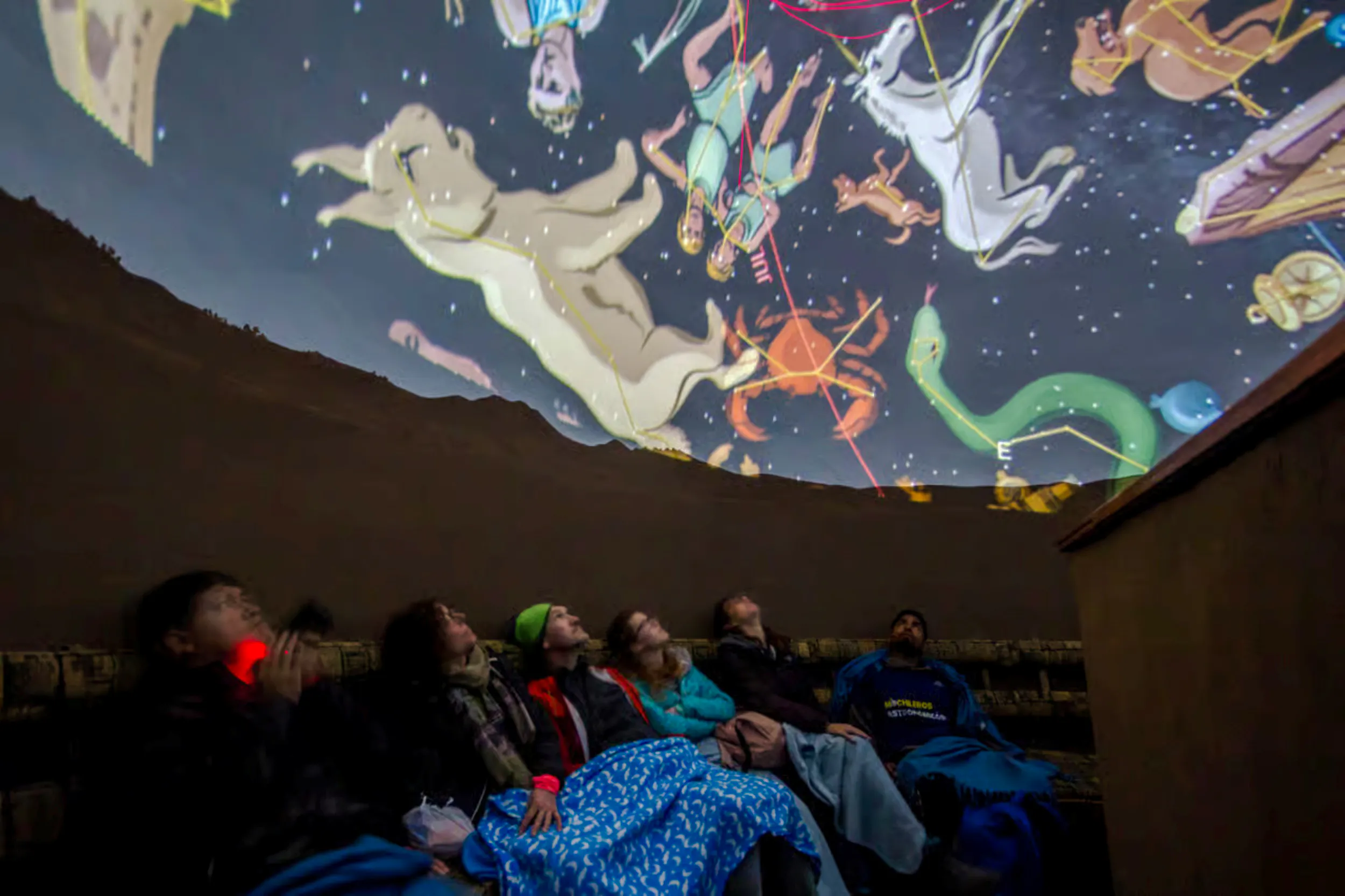 Visitors watching a constellation show at Cusco Planetarium, Peru.