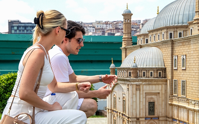 Guests examining a miniature model at Istanbul Miniatürk.
