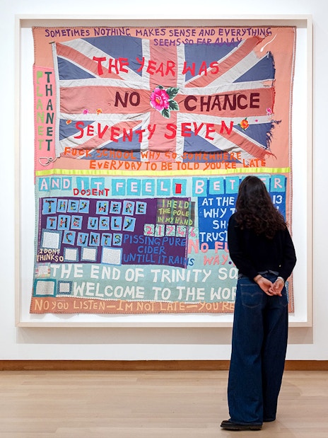 Visitor viewing Tracey Emin's "No Chance" exhibit at Stedelijk Museum.