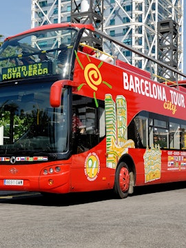 Red double-decker bus for Barcelona city tour with hop-on hop-off tickets.