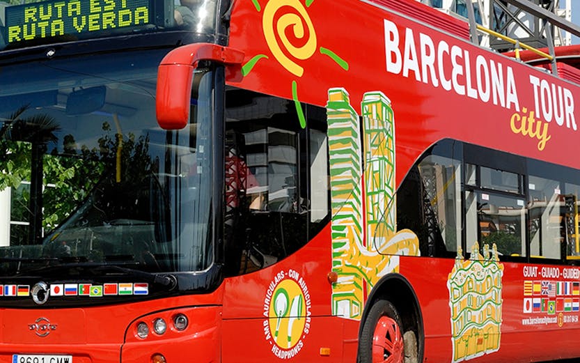 Red double-decker bus for Barcelona city tour with hop-on hop-off tickets.