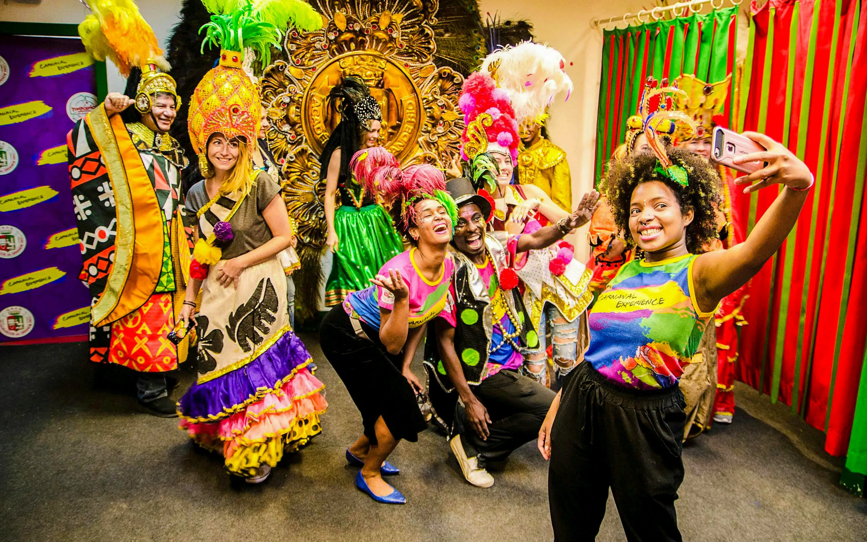 Participants in colorful costumes during a behind-the-scenes tour of the Rio Carnival.