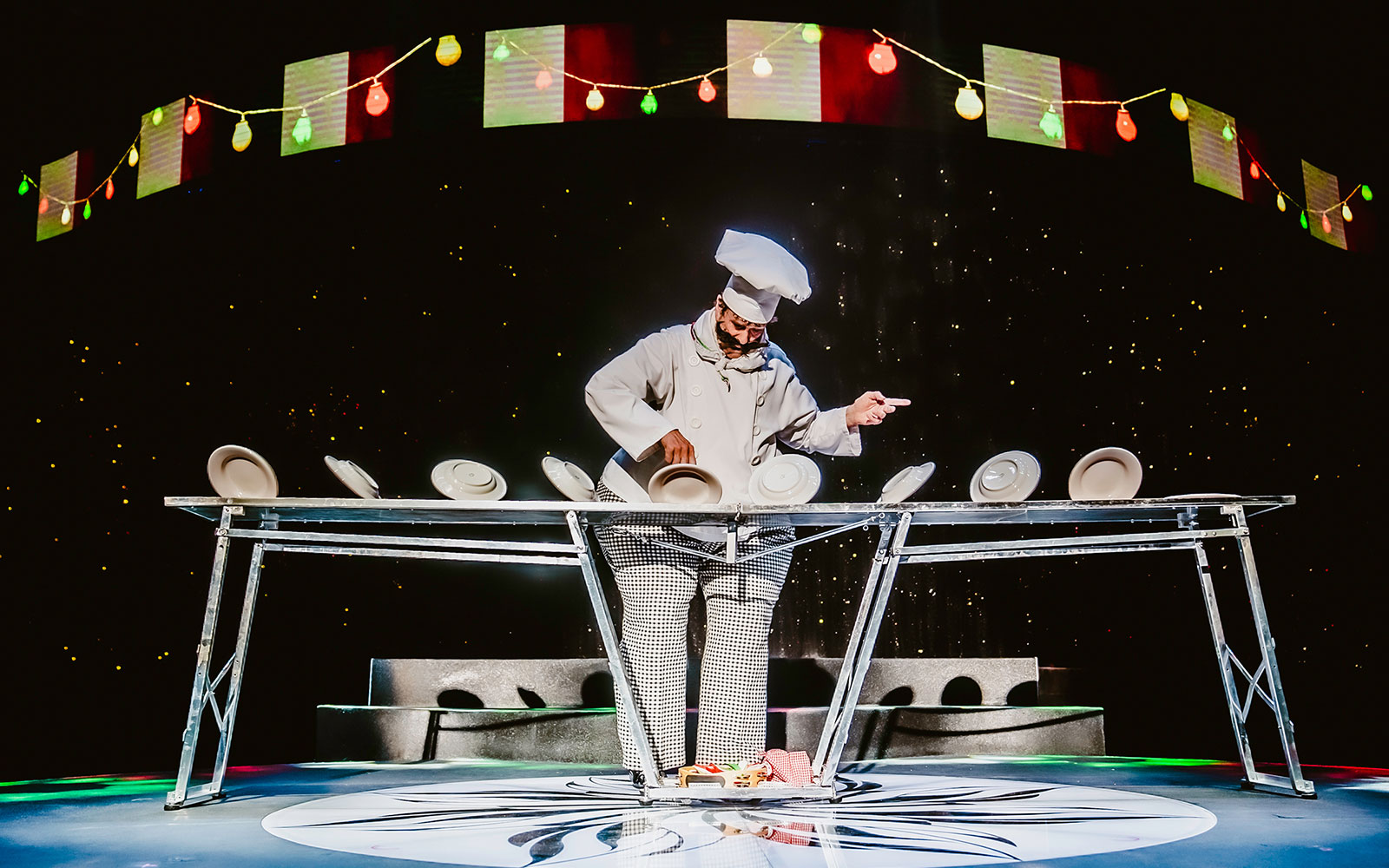 Performer balancing plates at WOW: The Vegas Spectacular show.