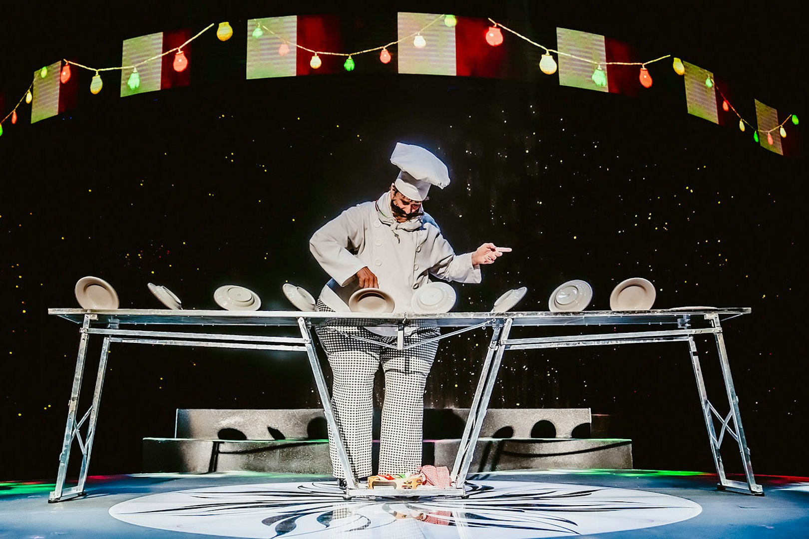 Performer balancing plates at WOW: The Vegas Spectacular show.