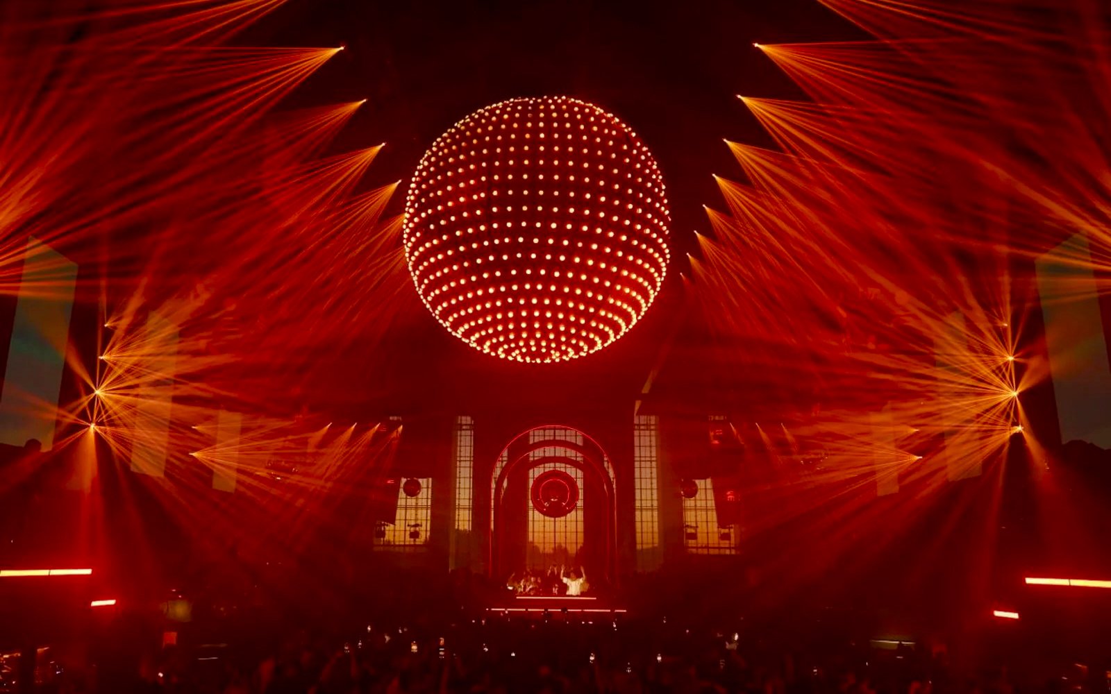 Red laser light show at a performance in Paradise, Ibiza.