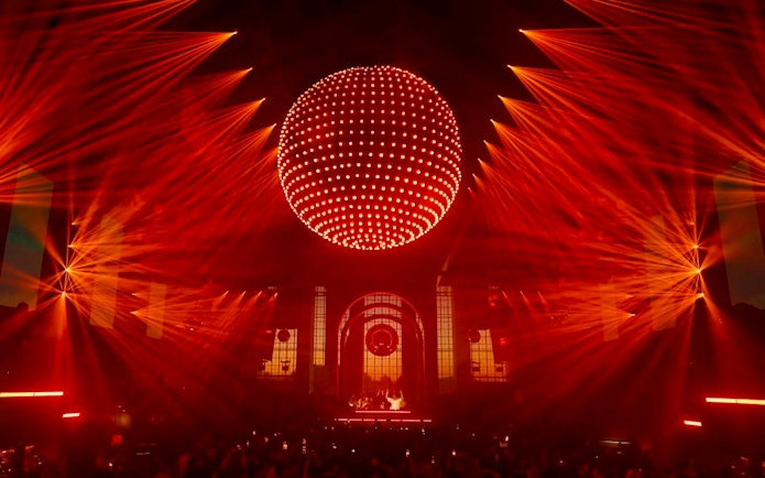 Red laser light show at a performance in Paradise, Ibiza.