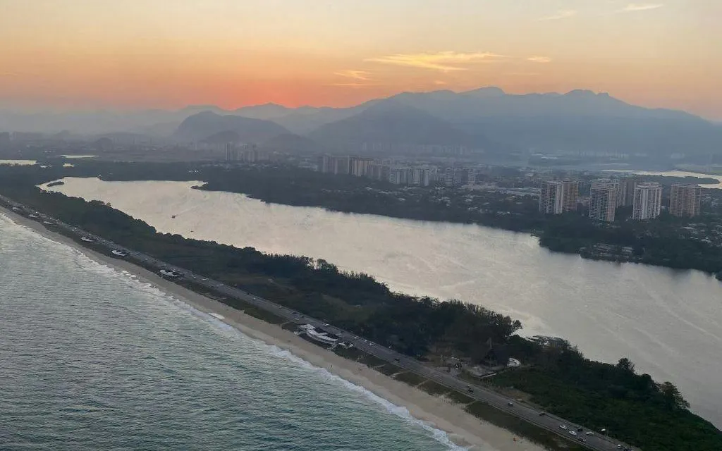 Sunset aerial view of Rio de Janeiro coastline during VIP helicopter tour.