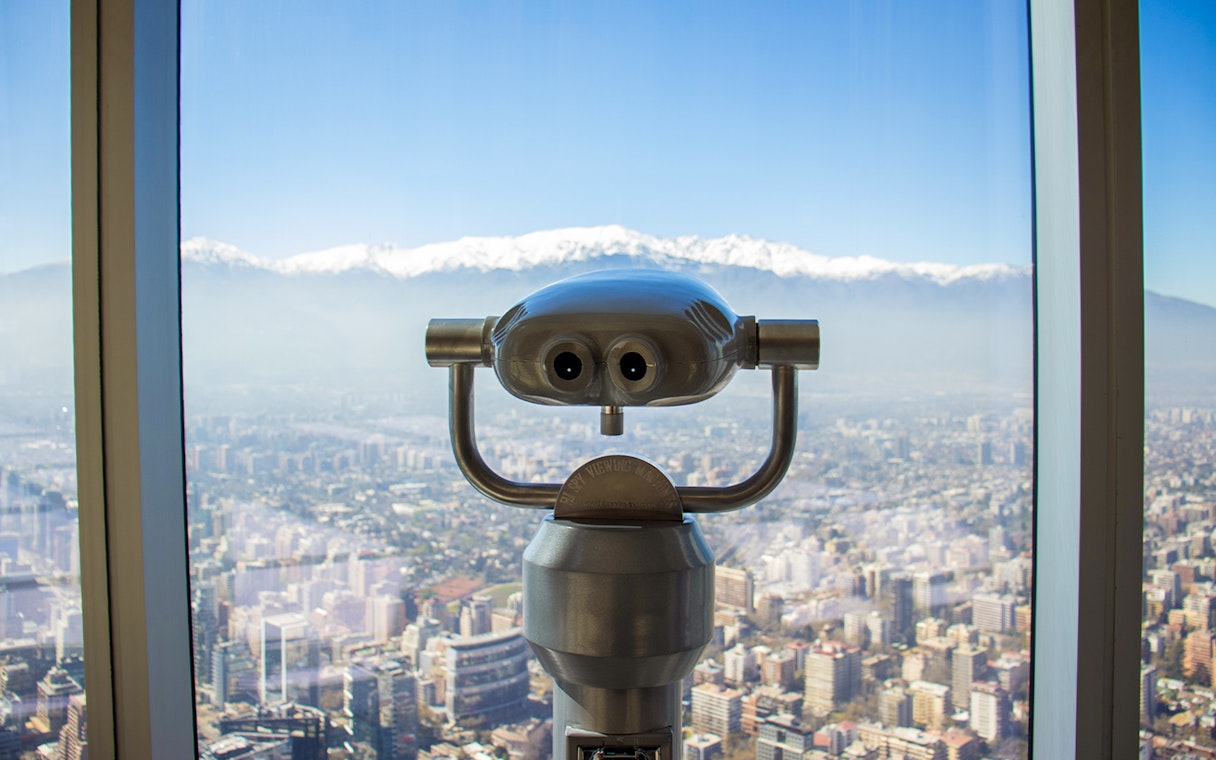 Viewing telescope overlooking Santiago from Sky Costanera, Chile.