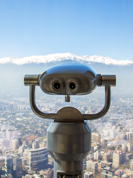 Viewing telescope overlooking Santiago from Sky Costanera, Chile.
