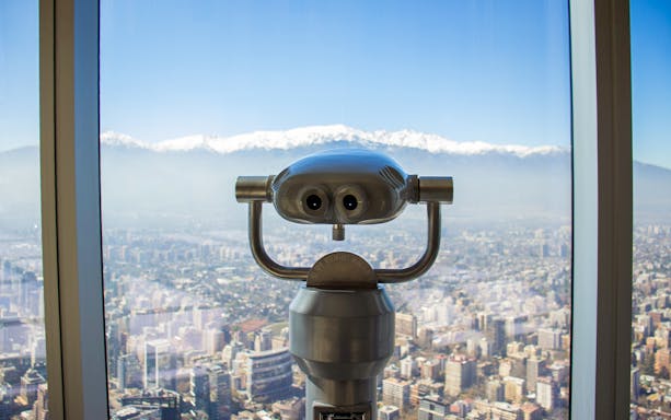 Viewing telescope overlooking Santiago from Sky Costanera, Chile.