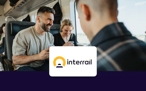 Group playing cards on a Rail Europe train journey.