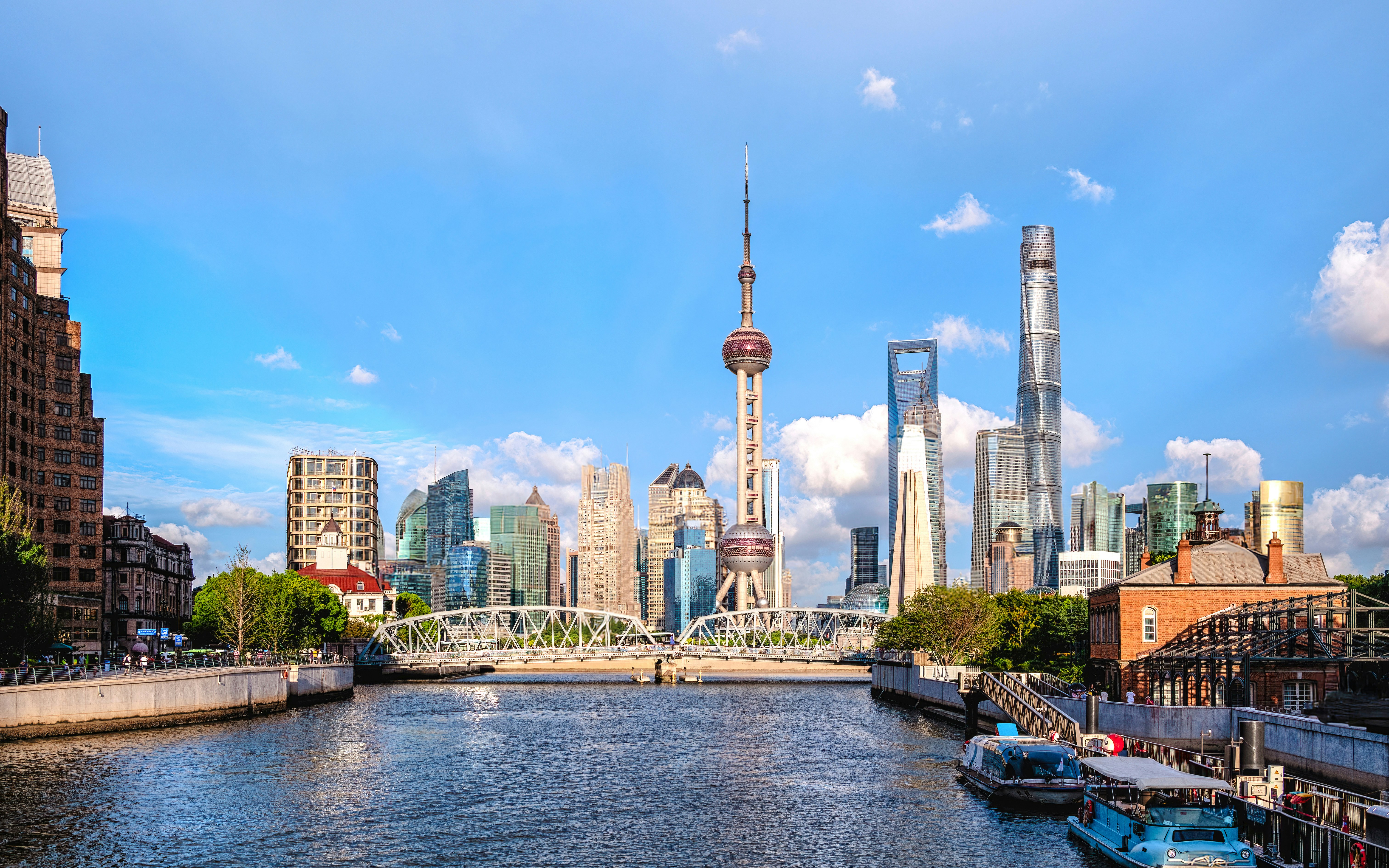 Shanghai skyline with Oriental Pearl Tower and skyscrapers in morning light.